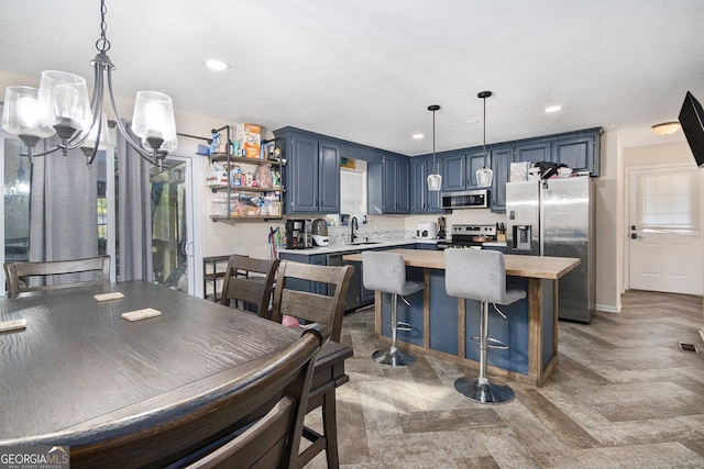 286 Opal St, Luthersville, GA 30251 - kitchen featuring open shelves, a sink, a kitchen island, blue cabinets, and appliances with stainless steel finishes