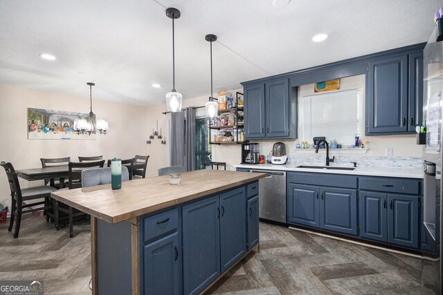 286 Opal St, Luthersville, GA 30251 - kitchen with a center island, stainless steel appliances, blue cabinets, and butcher block countertops