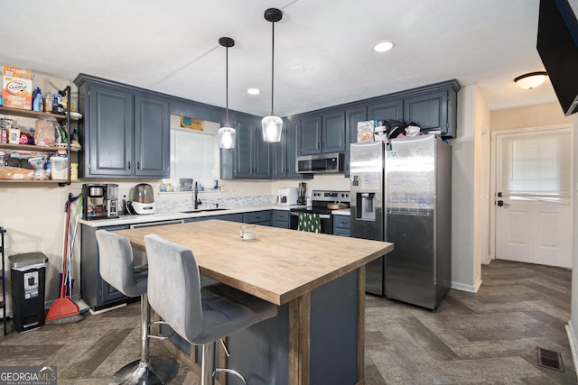 286 Opal St, Luthersville, GA 30251 - kitchen featuring visible vents, butcher block countertops, blue cabinets, a sink, and stainless steel appliances
