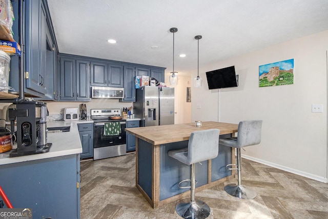 286 Opal St, Luthersville, GA 30251 - kitchen featuring a kitchen island, a breakfast bar area, stainless steel appliances, and blue cabinetry
