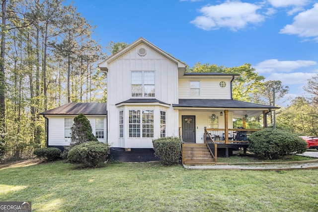 286 Opal St, Luthersville, GA 30251 - traditional-style house with board and batten siding, roof with shingles, covered porch, and a front yard