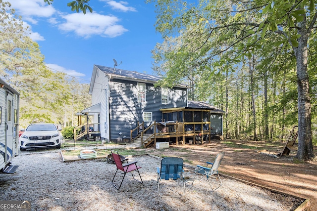 286 Opal St, Luthersville, GA 30251 - rear view of property with a wooden deck, a fire pit, and stairway