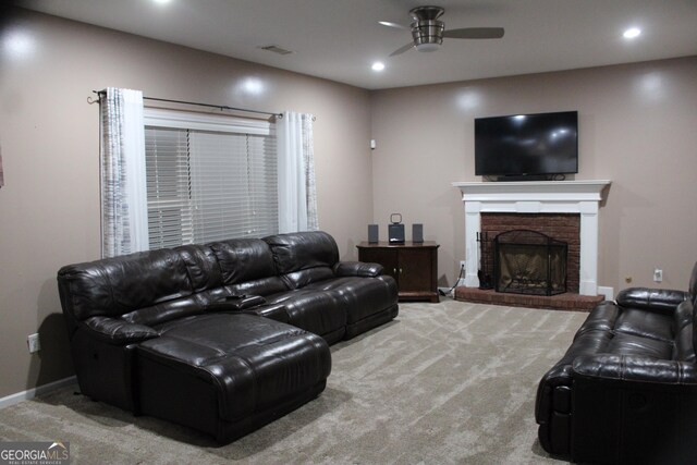 carpeted living room featuring a brick fireplace, recessed lighting, ceiling fan, and baseboards