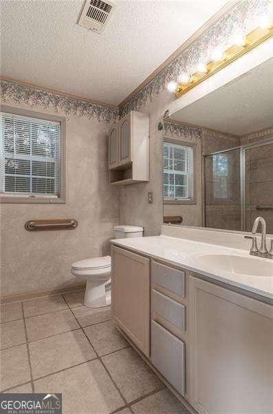 328 Allatoona Shores Dr, Canton, GA 30114 - bathroom with visible vents, toilet, plenty of natural light, and vanity