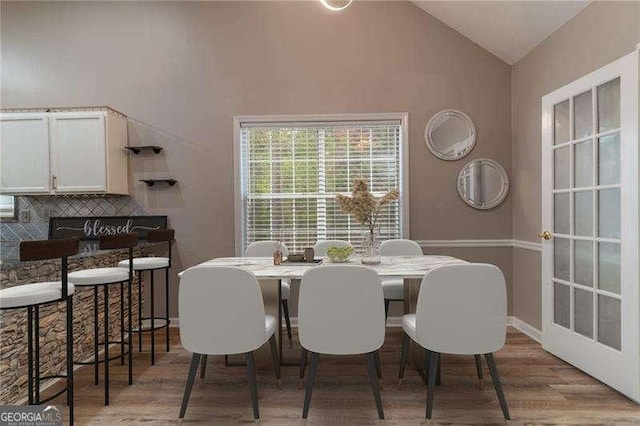 328 Allatoona Shores Dr, Canton, GA 30114 - dining space featuring vaulted ceiling and wood finished floors
