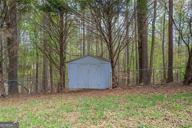 328 Allatoona Shores Dr, Canton, GA 30114 - view of shed featuring a wooded view and fence