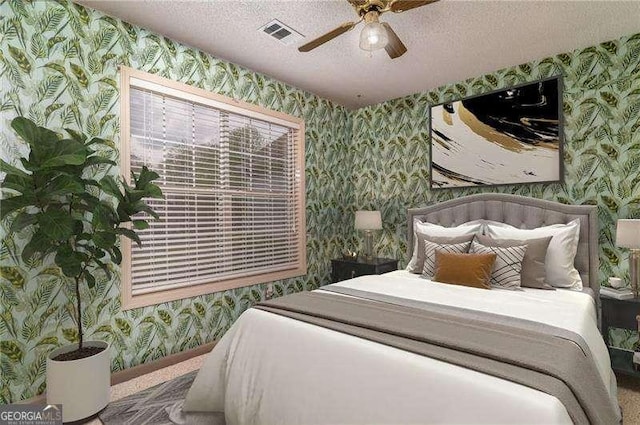 328 Allatoona Shores Dr, Canton, GA 30114 - bedroom featuring a textured ceiling, wallpapered walls, ceiling fan, and visible vents