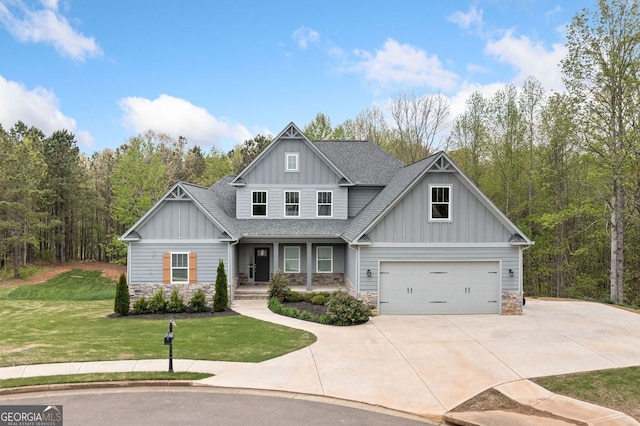 craftsman inspired home with concrete driveway, a front yard, board and batten siding, and stone siding