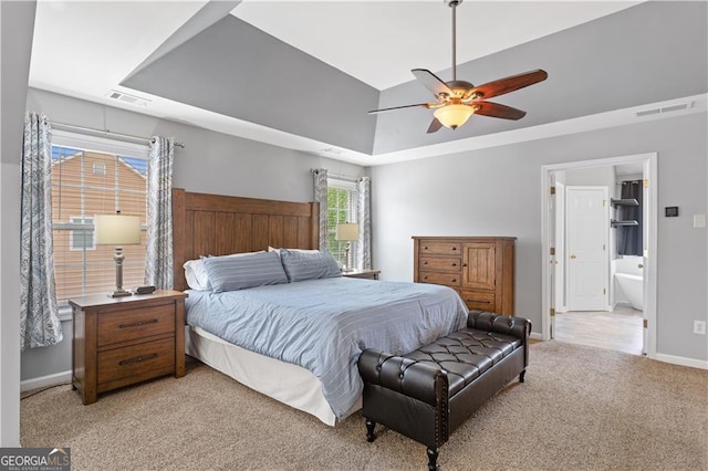 209 Crestmont Way, Canton, GA 30114 - bedroom with a raised ceiling, light colored carpet, baseboards, a ceiling fan, and ensuite bathroom