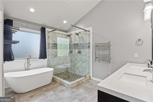 209 Crestmont Way, Canton, GA 30114 - full bath featuring radiator heating unit, a shower stall, wood finished floors, a freestanding bath, and vaulted ceiling