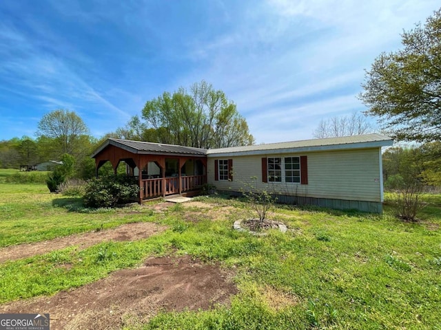 1546 Bob Mann Rd, Maysville, GA 30558 - view of front facade featuring a front yard and metal roof