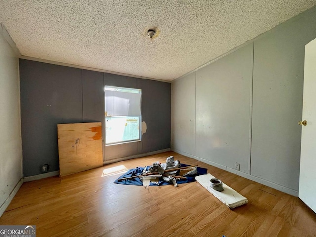 1546 Bob Mann Rd, Maysville, GA 30558 - spare room with a textured ceiling and wood finished floors