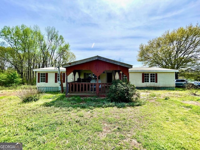 1546 Bob Mann Rd, Maysville, GA 30558 - rear view of house featuring a porch and a lawn