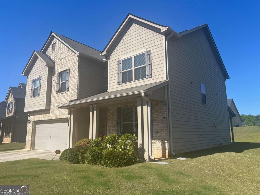 view of front of property featuring a front lawn, concrete driveway, an attached garage, a porch, and brick siding
