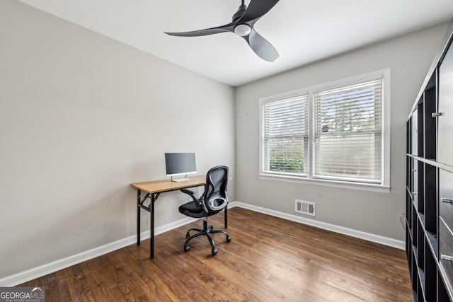 office area featuring wood finished floors, baseboards, and visible vents