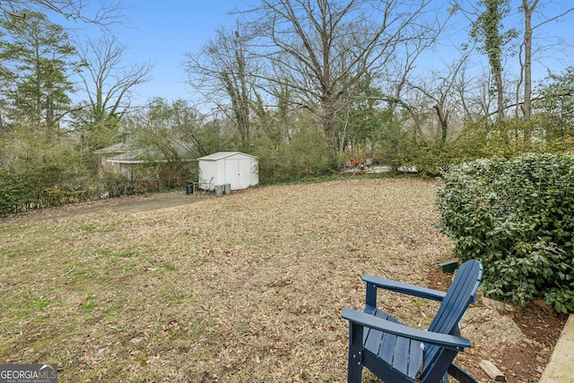 view of yard with a shed and an outbuilding