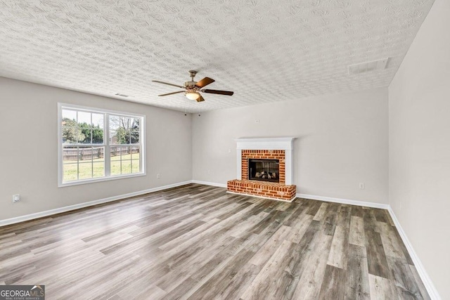 kitchen featuring light tile patterned floors, baseboards, stainless steel appliances, gray cabinets, and decorative backsplash