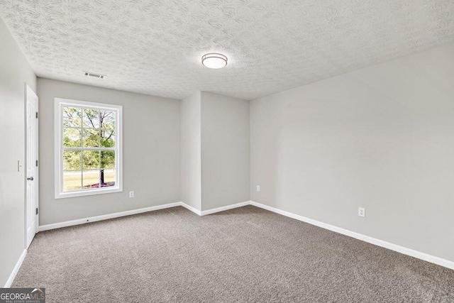unfurnished living room featuring baseboards, a brick fireplace, visible vents, ceiling fan with notable chandelier, and wood finished floors