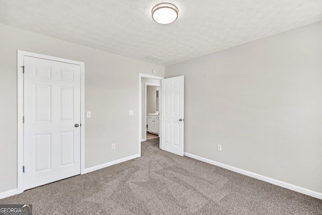 bathroom featuring toilet, wood finished floors, and baseboards