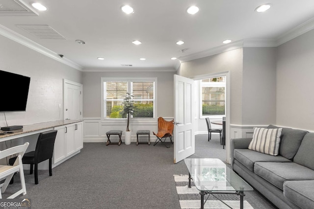 carpeted living area with recessed lighting, wainscoting, and crown molding