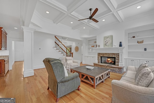 866 Coopers Ridge Path SW, Grayson, GA 30017 - living area featuring a ceiling fan, decorative columns, built in features, recessed lighting, and a stone fireplace