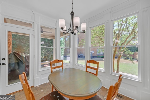 866 Coopers Ridge Path SW, Grayson, GA 30017 - dining room featuring a decorative wall, a chandelier, and plenty of natural light
