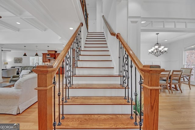 866 Coopers Ridge Path SW, Grayson, GA 30017 - staircase with wood finished floors, beam ceiling, recessed lighting, a chandelier, and crown molding