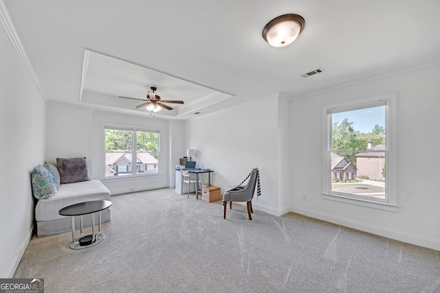 866 Coopers Ridge Path SW, Grayson, GA 30017 - living area with crown molding, carpet, a raised ceiling, a ceiling fan, and baseboards