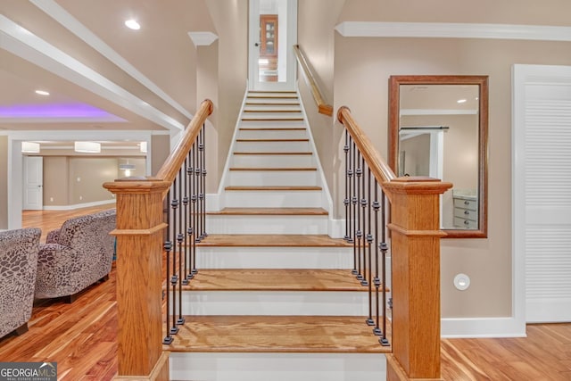 866 Coopers Ridge Path SW, Grayson, GA 30017 - stairway with crown molding, baseboards, wood finished floors, and recessed lighting