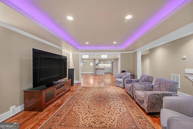866 Coopers Ridge Path SW, Grayson, GA 30017 - living room featuring wood finished floors, a raised ceiling, recessed lighting, and baseboards