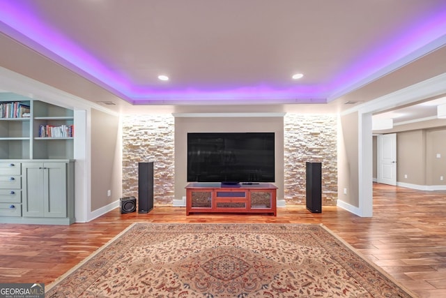 866 Coopers Ridge Path SW, Grayson, GA 30017 - unfurnished living room with wood finished floors, a tray ceiling, recessed lighting, and baseboards