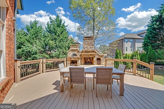 866 Coopers Ridge Path SW, Grayson, GA 30017 - deck featuring an outdoor stone fireplace and outdoor dining area