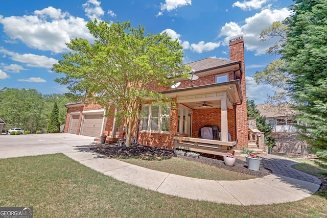 866 Coopers Ridge Path SW, Grayson, GA 30017 - view of front of home featuring brick siding, concrete driveway, a chimney, an attached garage, and ceiling fan