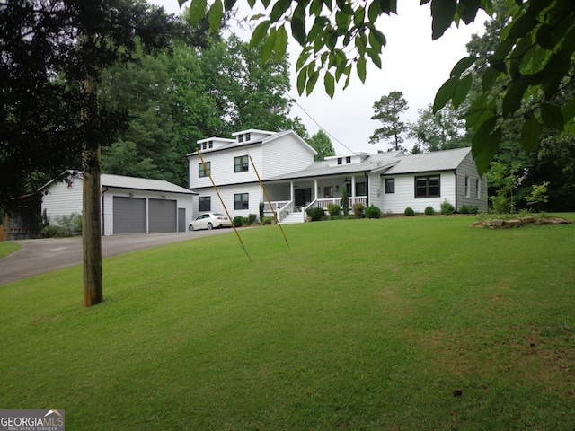 16080 Freemanville Rd, Alpharetta, GA 30004 - view of front of property with a porch, a front yard, an outdoor structure, and a garage