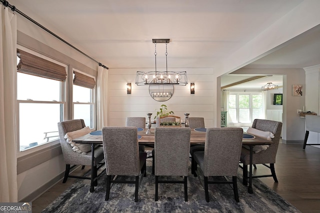 16080 Freemanville Rd, Alpharetta, GA 30004 - dining area featuring a chandelier, dark wood finished floors, and baseboards