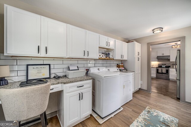 16080 Freemanville Rd, Alpharetta, GA 30004 - kitchen with appliances with stainless steel finishes, white cabinets, open floor plan, a peninsula, and dark wood-style flooring