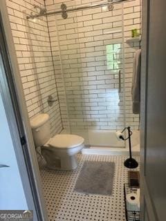 16080 Freemanville Rd, Alpharetta, GA 30004 - full bathroom featuring toilet, a tile shower, and tile patterned floors
