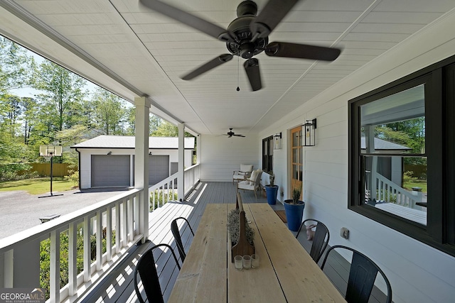16080 Freemanville Rd, Alpharetta, GA 30004 - covered porch featuring an outdoor structure, a garage, and ceiling fan