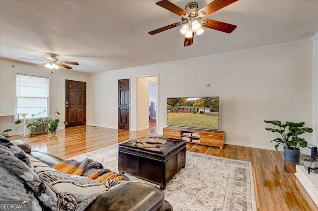 241 Burke Cir, Mcdonough, GA 30253 - living room with wood finished floors, ornamental molding, baseboards, and a ceiling fan