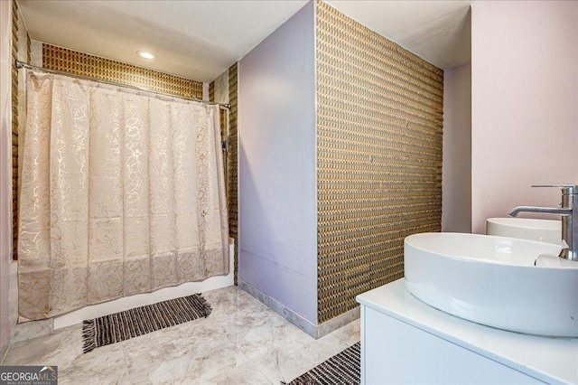241 Burke Cir, Mcdonough, GA 30253 - full bath featuring baseboards, shower / bath combination with curtain, a sink, recessed lighting, and marble finish floor