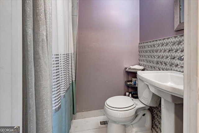 241 Burke Cir, Mcdonough, GA 30253 - bathroom with a shower with shower curtain, visible vents, and toilet