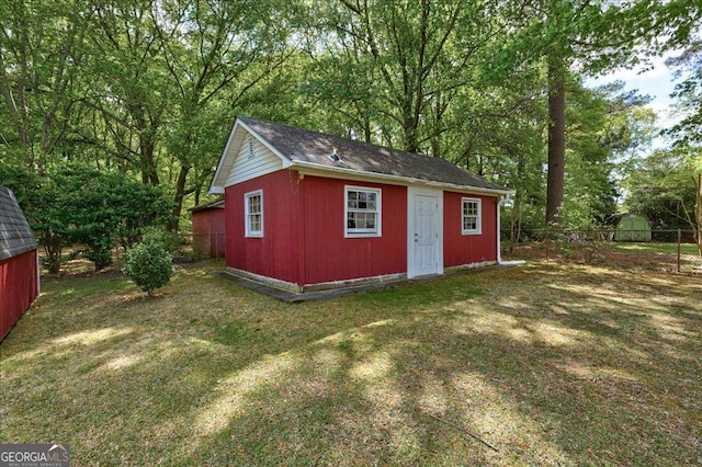 241 Burke Cir, Mcdonough, GA 30253 - view of outbuilding with an outdoor structure and fence