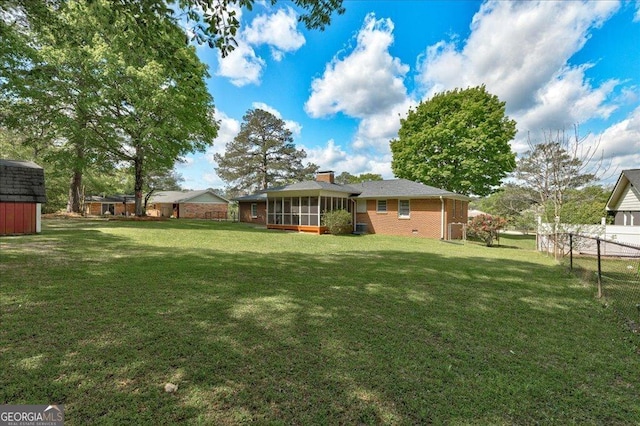 241 Burke Cir, Mcdonough, GA 30253 - view of yard with a storage shed, fence private yard, an outdoor structure, and a sunroom
