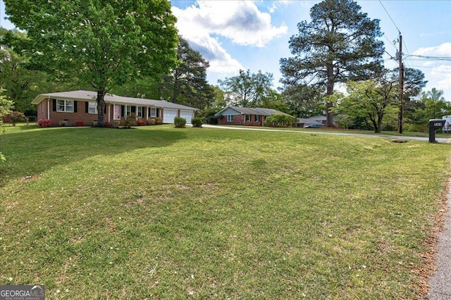 241 Burke Cir, Mcdonough, GA 30253 - view of yard with an attached garage