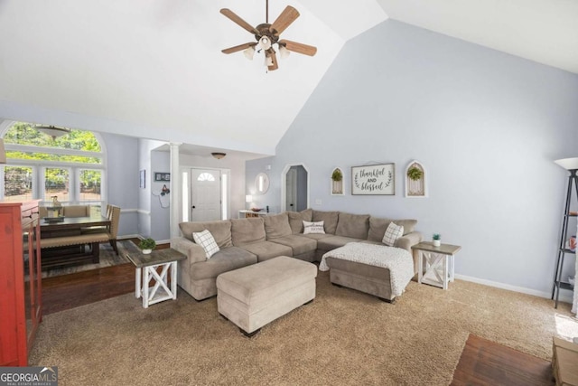840 Whitby Dr, Douglasville, GA 30134 - living room with decorative columns, high vaulted ceiling, ceiling fan, carpet, and baseboards