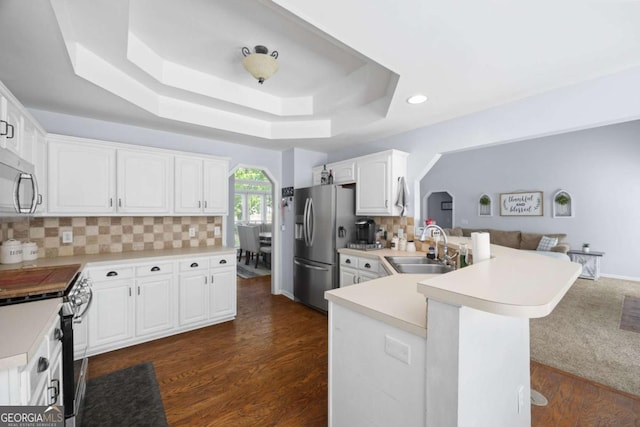 840 Whitby Dr, Douglasville, GA 30134 - kitchen with a peninsula, recessed lighting, appliances with stainless steel finishes, light countertops, and a sink