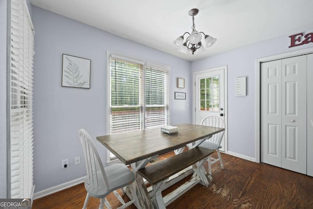 840 Whitby Dr, Douglasville, GA 30134 - dining area featuring baseboards, an inviting chandelier, and wood finished floors
