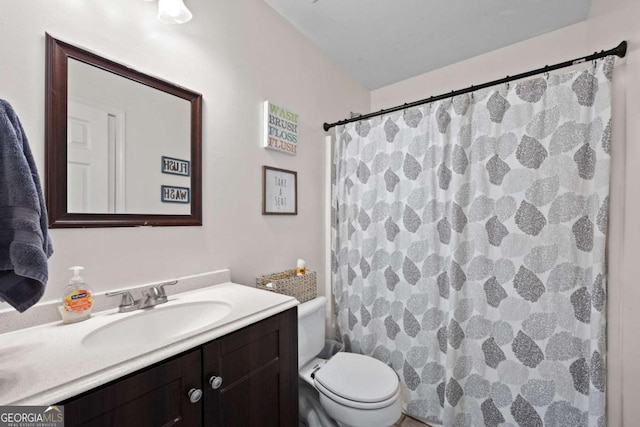 840 Whitby Dr, Douglasville, GA 30134 - bathroom with toilet, vanity, and a shower with shower curtain