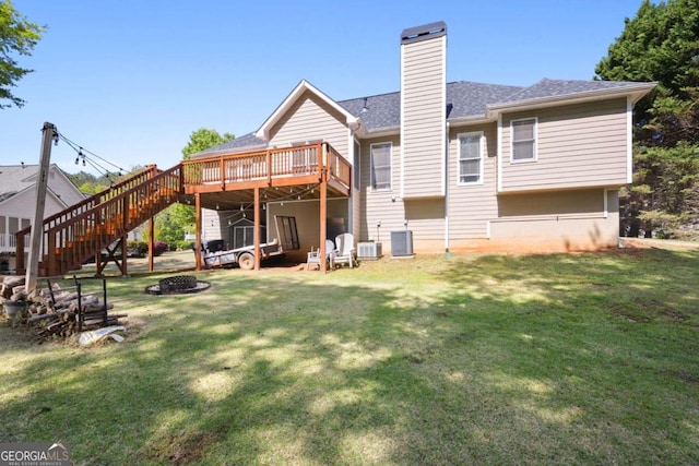 840 Whitby Dr, Douglasville, GA 30134 - back of property with a deck, a yard, an outdoor fire pit, stairway, and central air condition unit