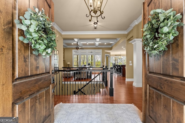 176 Stamp Mill Ln, Dahlonega, GA 30533 - foyer entrance featuring crown molding, ceiling fan with notable chandelier, decorative columns, wood finished floors, and baseboards
